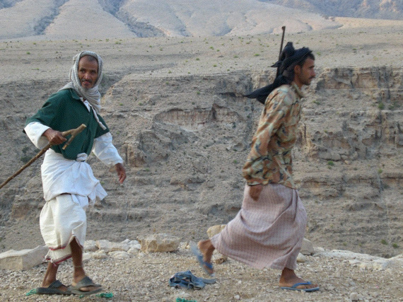 armed Omani men on track, Wadi Ash Shab, Oman